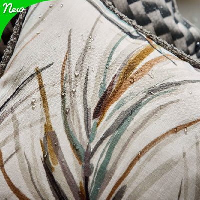 Two outdoor chairs one with white and black fabric. the other blue with palms. high quality finish