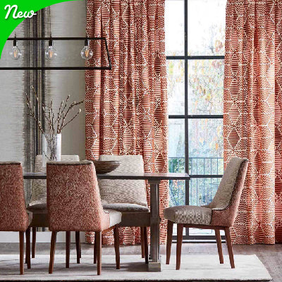 Designer red fabric on chairs with red patterned drapery