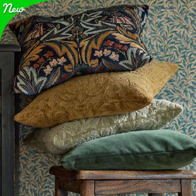 Luxurious velvet green fabric on bed in cozy bedroom