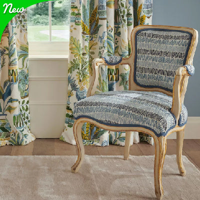 Botanical Green & Blue Fabric on Curtains and chairs in high class living room