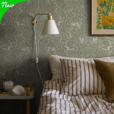 Schumacher Craft Revival Green and White Floral Patterened Wallpaper Collection in bedroom. New for 2025 Designer Wallpaper