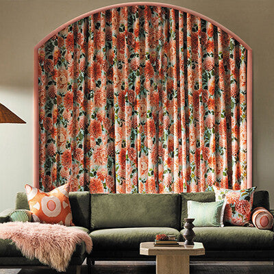 Harlequin Colour 2 Fabric Green & red Floral fabric in living room with green couch